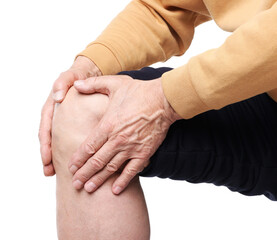 Senior man suffering from knee pain on white background, closeup