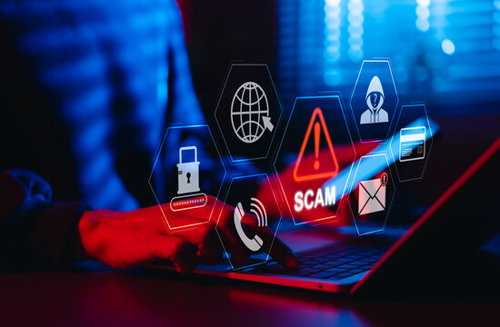 Scam Alert Warning with Cybersecurity Icons. Man holding smartphone while using laptop, warning sign for scams with icons online threats, phishing, cybersecurity, Unknown person, suspicious scammer,