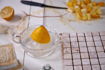 the process of preparing a natural cleaning product with lemons for cleaning the house, still life top view