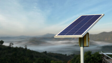 A solar panel set up in a remote location, providing electricity to homes without access to the main grid.