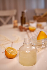 the process of preparing a natural cleaning product with lemons for cleaning the house, still life top view