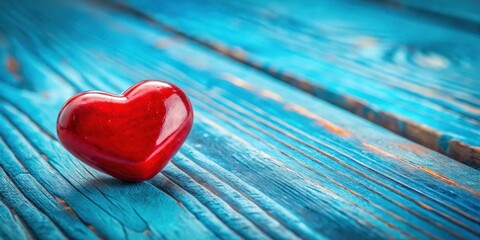 A red heart rests on a weathered blue wooden plank, capturing the essence of love and simplicity.