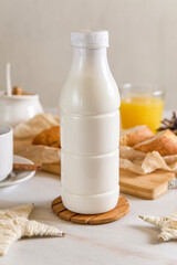 plastic bottle mockup with cap on a white table