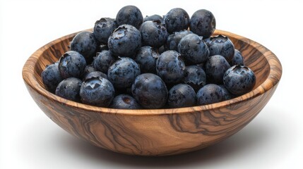 Bowl filled with fresh blueberries. Close up of delicious and sweet fruit. Ready for a snack or to use in a tasty recipe.