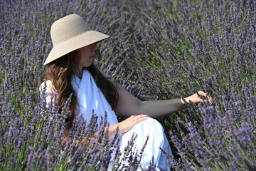 girl in white dress on lavender field,