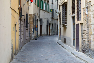 Houses along a narrow street in the old town of Florence where there is no traffic now