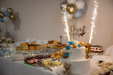 A vibrant Celebration Table adorned with a delightful Cake and elegant Decor pieces