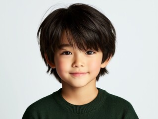 Young boy in green sweater and black tie, a portrait of classic style youthful charm