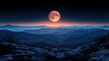 Red moon over mountain range at dawn