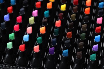 Many colorful markers in bag, closeup. Art supplies © New Africa