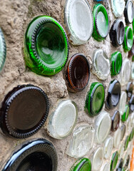 Concrete wall with multi-colored bottles