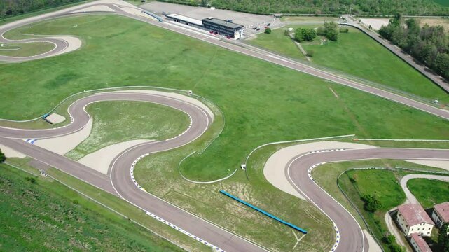 Zig zag racetrack of large autodrome from aerial view shot in sunny day, road markings for sport cars racing and competition