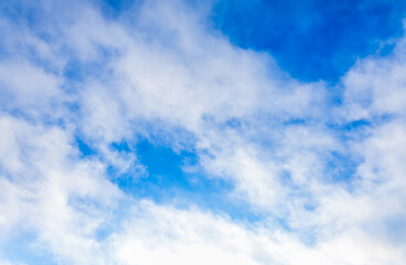 Beautiful blue sky and white fluffy group of clouds background in the morning skyline