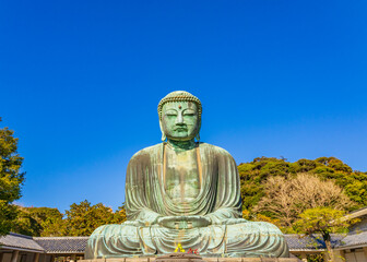 Ancient bronze statue of the Great Buddha Daibutsu at Kotoku-in temple in Kamakura, Japan. It is an important landmark and a popular destination for tourists.