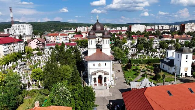 Drone Zoom-out shot reveals the Church of St. John the Baptist in Ramnicu Valcea, Romania