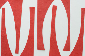 abstract, red paper shapes (some with gothic arch tops) on blank paper