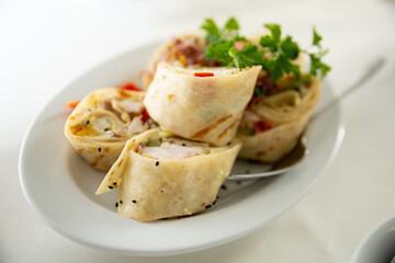 Deliciously Rolled Savory Wraps, Expertly Crafted with Fresh Herbs and Flavorful Fillings