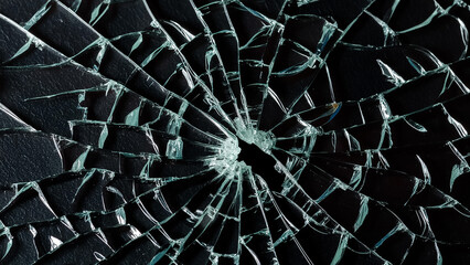 Obraz premium Broken glass with a black background, texture, overlay, broken glass, cracked glass