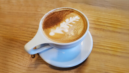 breakfast Italian cappuccino on a wooden table