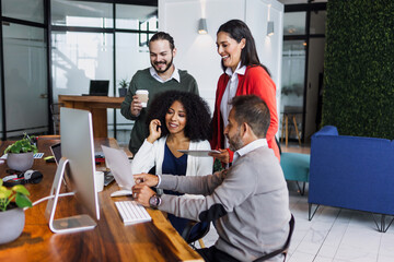 latin business people having a discussion and working in an office in Mexico Latin America,...