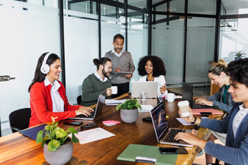 latin business people having a discussion and working in an office in Mexico Latin America,...
