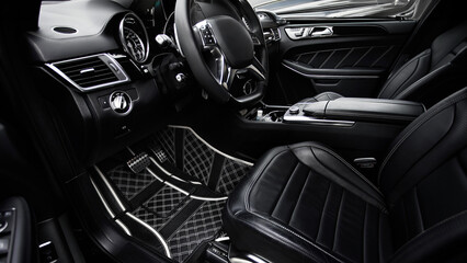 Modern interior of the car - rear seats with seat belts. black leather interior