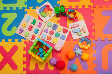 Children's educational toys on a play mat.