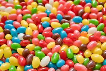 Colorful chewable candies as a bright background. Lots of multicolored candies close-up for sale in the store.