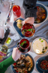 Festive Cheers with Cranberry Cocktails Over a Gourmet Dinner