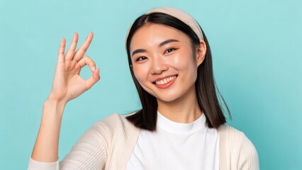 Smiling woman showing okay hand gesture