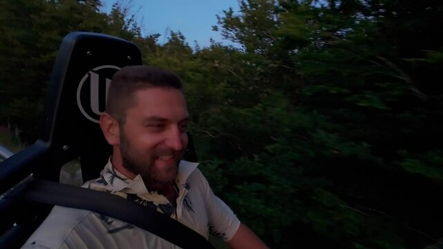 Bearded Man Enjoying an Alpine Coaster Ride at the Peak of Lovcen Mountain, Montenegro