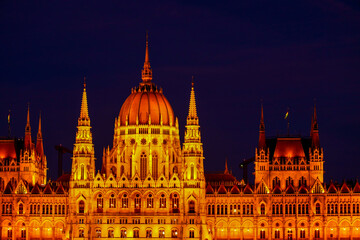 Obraz premium Budapest parliament building great architectural landmark in the capital of Hungary. Magyar capital city tourist sights. Sightseeing of Budapest parliament during the day and night illumination before