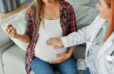woman pregnant mother pregnancy belly doctor patient visit pill prescription tablet maternity...