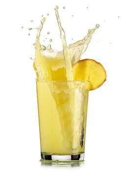 Ginger juice in a glass splash on white background, studio shot