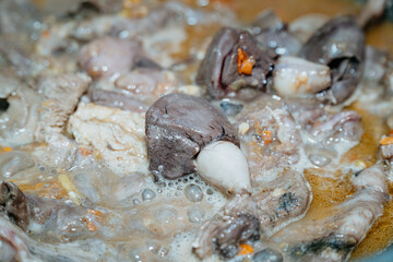 fish heart and fish entrails being boiled
