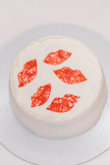 Handmade white cream cake, female lip prints
