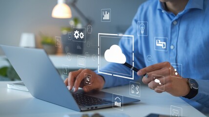 Man uses laptop and points to cloud computing interface