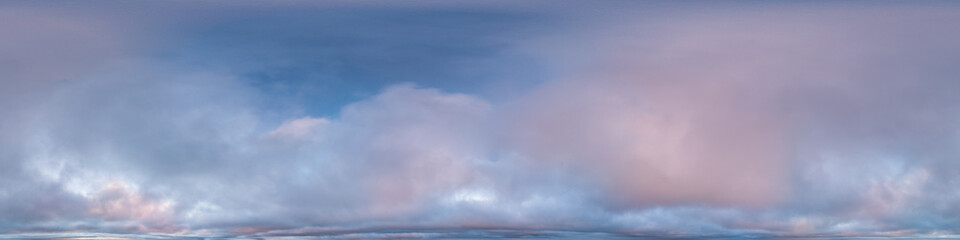 Serene Panoramic Cloudscape Under Expansive Blue Sky During Sunset