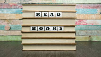 Phrase Read BOOKS on pile of books 
