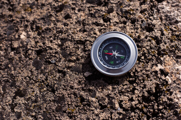 Compass on the stone background