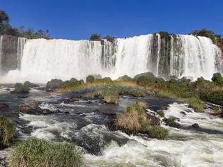 Rainbow formed in the falls of Iguazu Falls