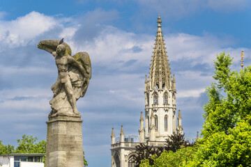 Fototapeta premium monument to the glory of Ferdinand von Zeppelin and detail of the tower Konstanz Minster or Konstanz Cathedral ..in Konstanz Constance, Germany