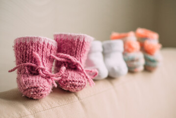 Pregnancy motherhood perenthood concept, Three pairs of baby booties , baby shower, first birthday party banner, handmade socks, daycare, kindergarten, day nursery
