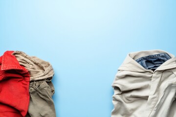 Comparison of dirty clothes and freshly laundered garments on a blue background, showing the difference in cleanliness and texture. Generative AI