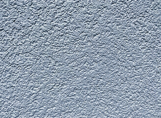 The image is a close-up of a textured surface. The surface appears to be made up of small,...