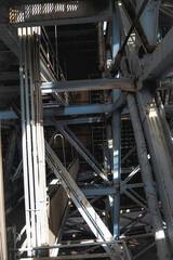 Inside of the huge metal construction made of structures, metal trusses, and joints