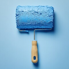 Obraz premium A single paint roller with blue paint, minimal composition