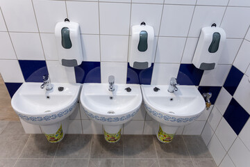 Discover Modern Bathroom Amenities featuring stylish Sinks, Dispensers, and more