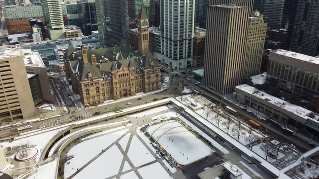 Aerial winter view of Nathan Phillips Square and Old City Hall in Toronto 4K