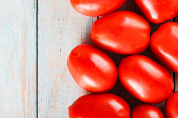 Freshly Harvested Italian Piccadilly Tomatoes on Rustic Wooden Surface for Wholesome Diet, Top View, Copy Space